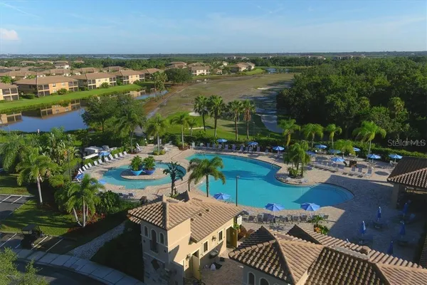 an aerial view of a house with outdoor space