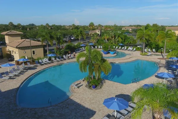 a view of a swimming pool with a chairs