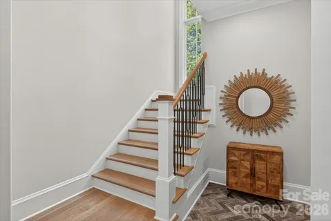 a front view of a house with entryway and wooden floor