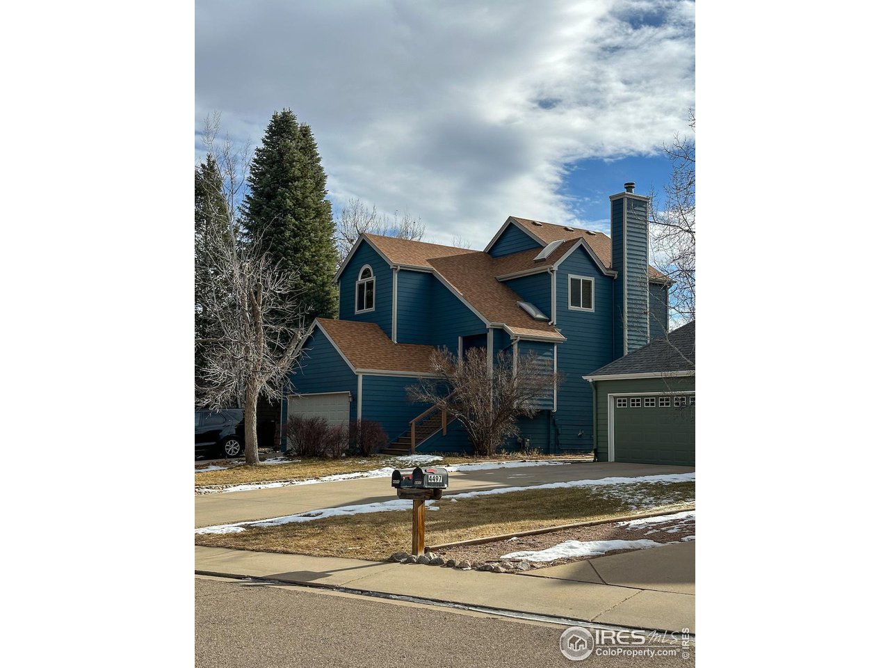 4491 Wellington Road Boulder, CO 80301 - Photo 1 of 40 a view of a building with a street