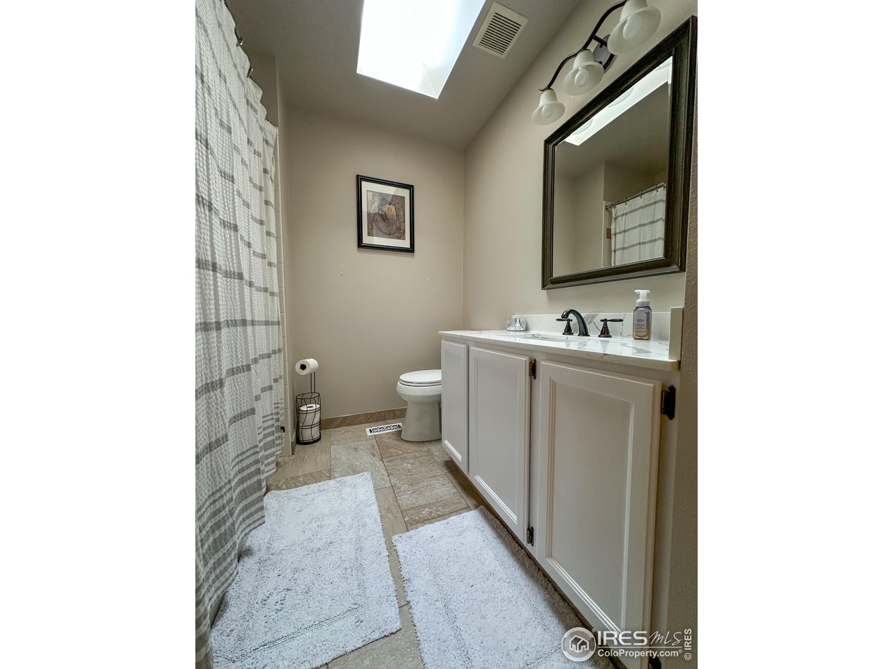 4491 Wellington Road Boulder, CO 80301 - Photo 12 of 40 a bathroom with a sink toilet and shower