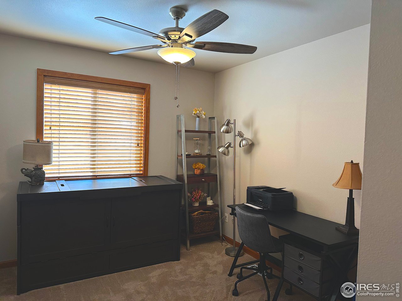 4491 Wellington Road Boulder, CO 80301 - Photo 13 of 40 a view of a workspace with furniture and a window