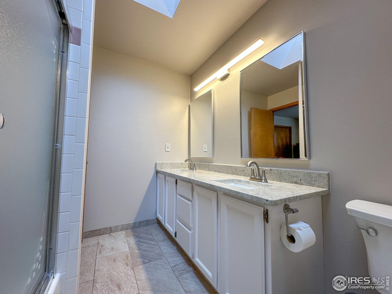 4491 Wellington Road Boulder, CO 80301 - Photo 15 of 40 a bathroom with a sink and a mirror