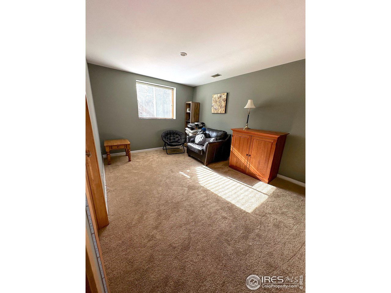 4491 Wellington Road Boulder, CO 80301 - Photo 16 of 40 a view of a livingroom with furniture and window