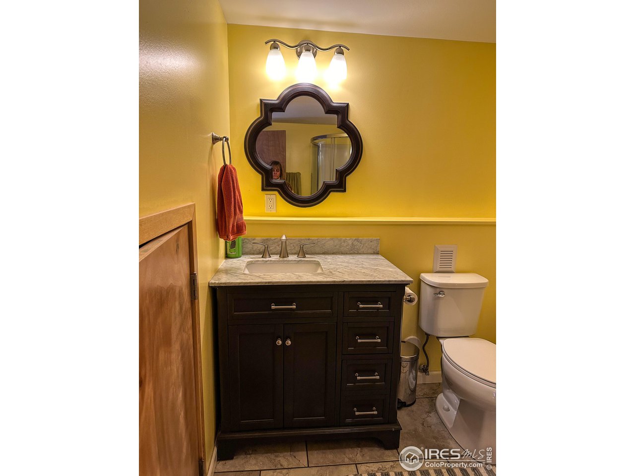 4491 Wellington Road Boulder, CO 80301 - Photo 17 of 40 a bathroom with a sink and a mirror