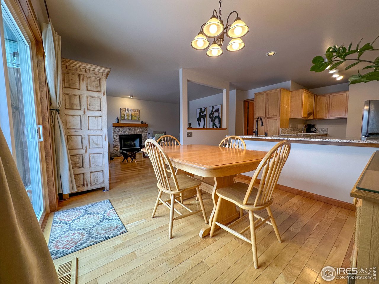 4491 Wellington Road Boulder, CO 80301 - Photo 3 of 40 a view of a dining room with furniture and wooden floor