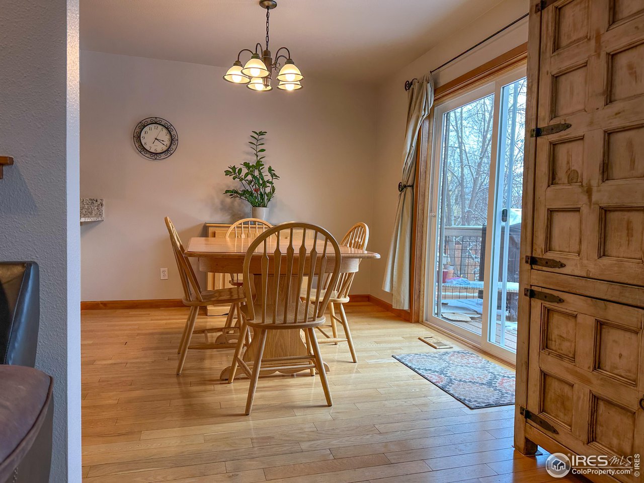 4491 Wellington Road Boulder, CO 80301 - Photo 8 of 40 a view of a dining room with furniture window and wooden floor