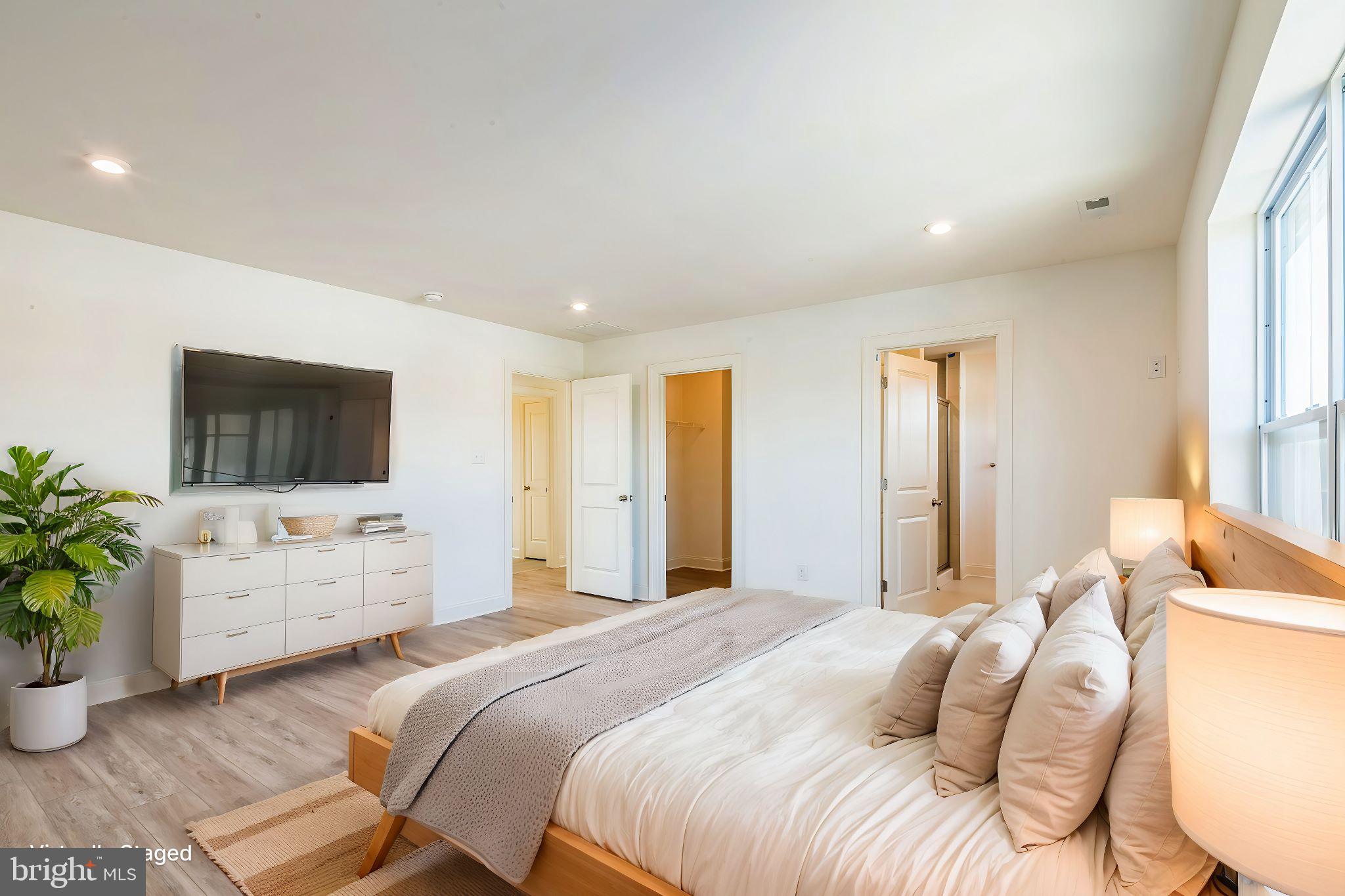 133 A Woosamonsa Road Pennington, NJ 08534 - Photo 23 of 25 a bedroom with a bed and a flat screen tv