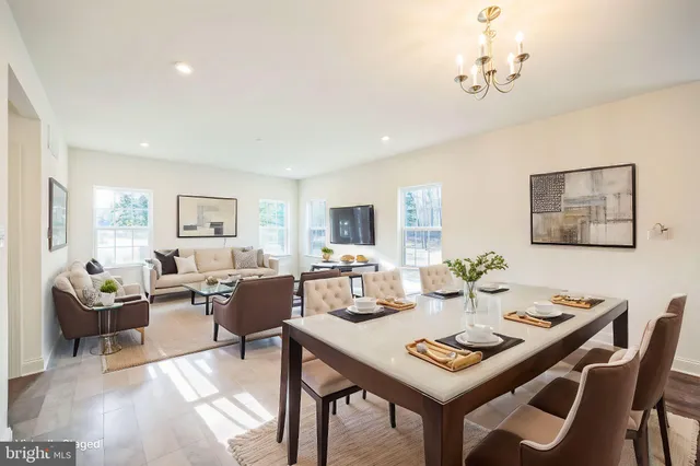 a view of a dining room with furniture and a livingroom