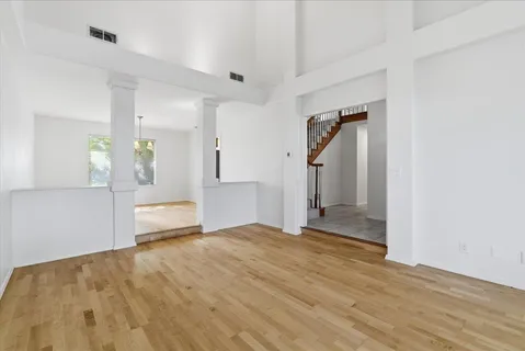 a kitchen with cabinets appliances and a window