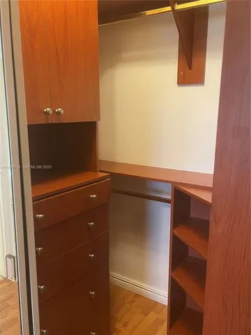 a view of storage and utility room with racks on wall