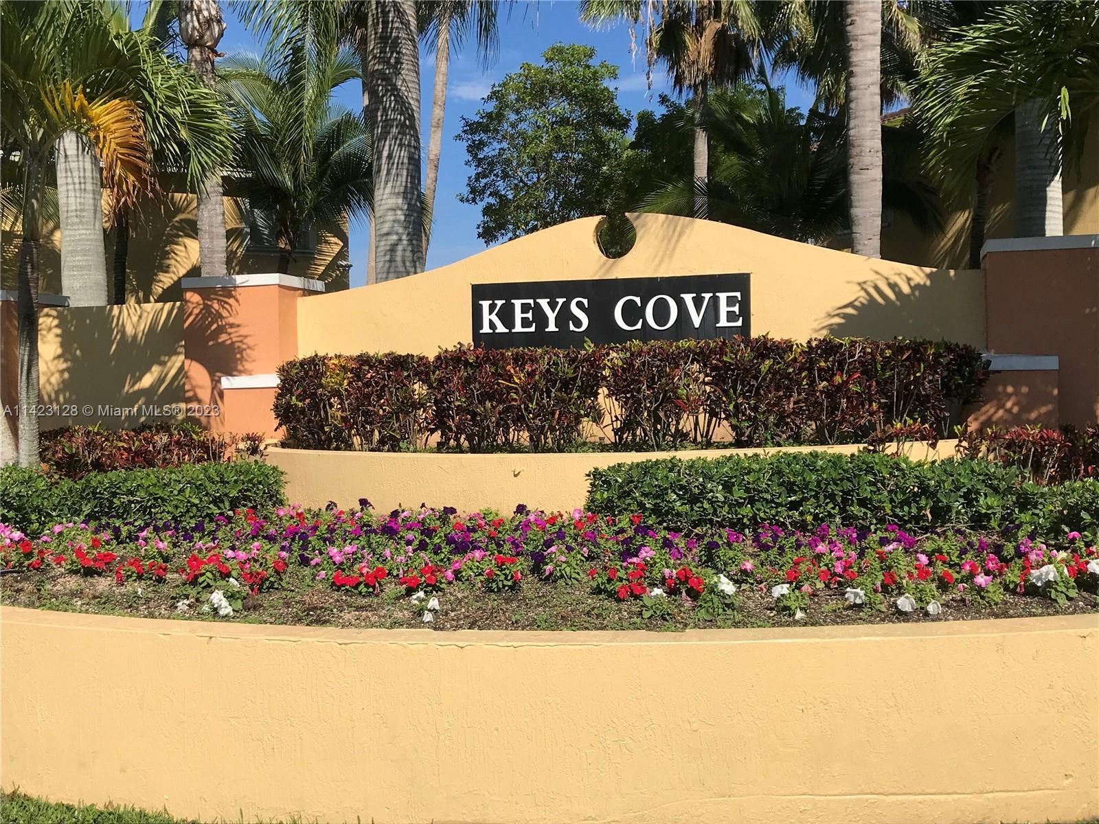 1652 Southeast 28th Street, Unit 105 Homestead, FL 33035 - Photo 14 of 18 a view of outdoor space with garden