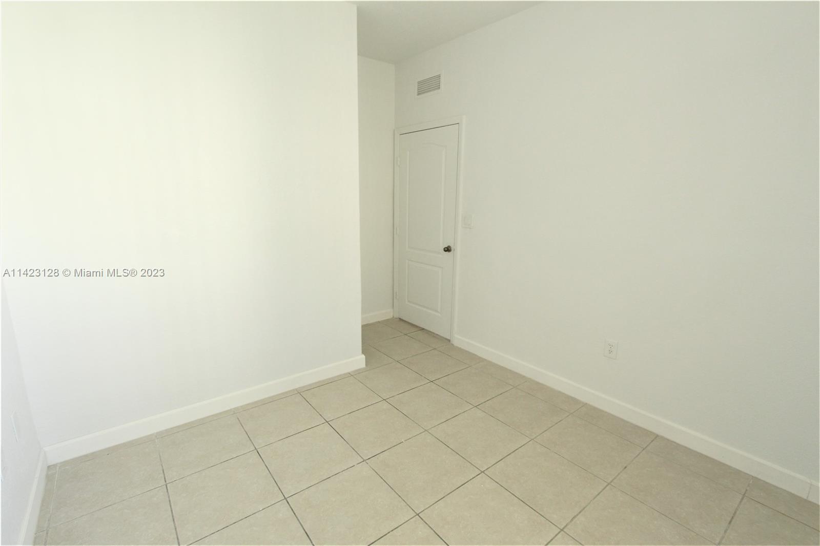 1652 Southeast 28th Street, Unit 105 Homestead, FL 33035 - Photo 7 of 18 a view of an empty room