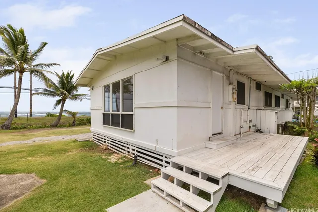 a terrace of a house with outdoor seating