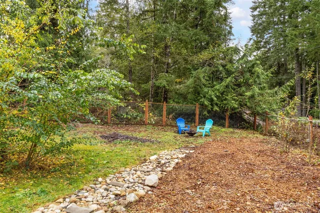 a view of a yard with furniture