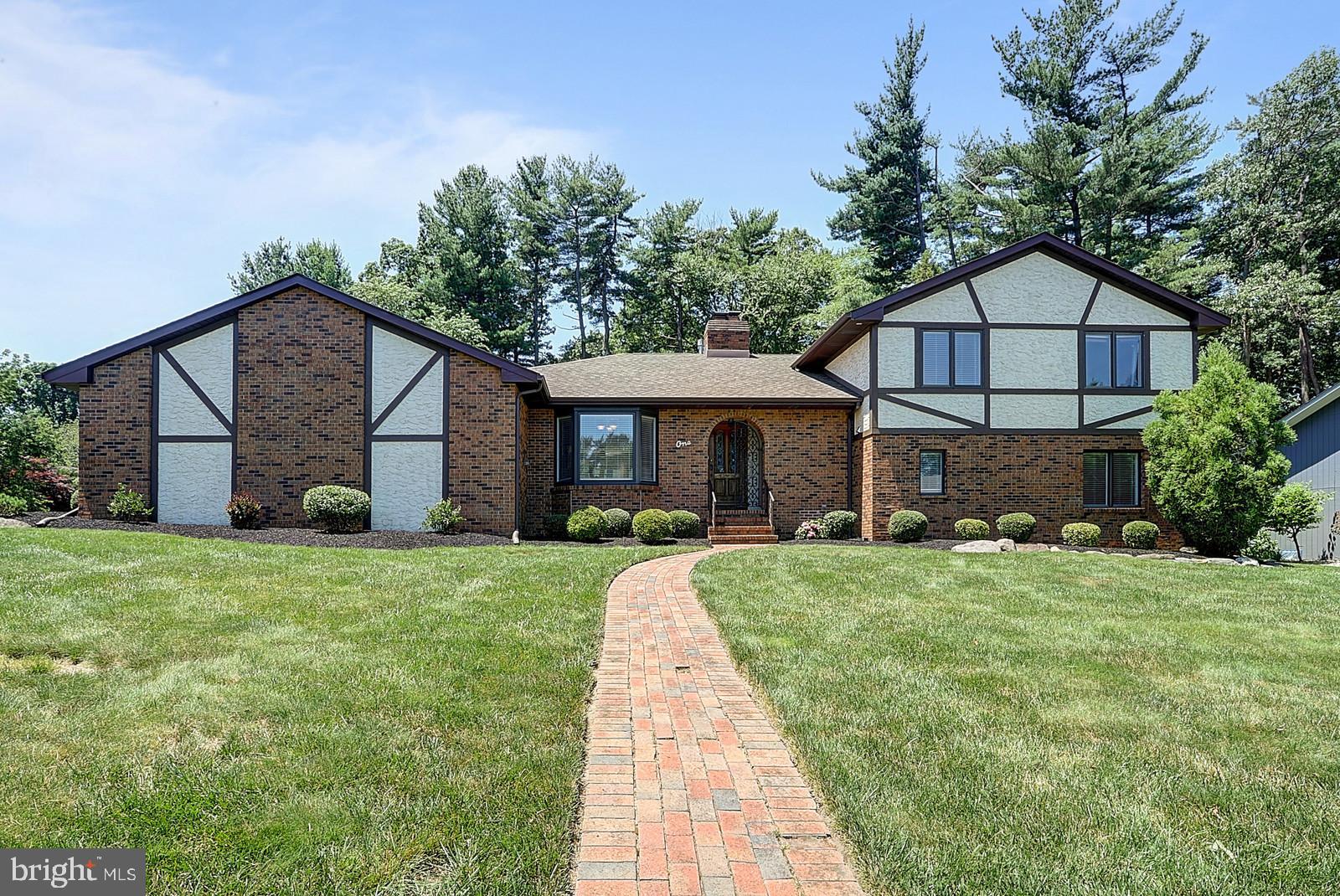 1 Cavalier Drive Hamilton, NJ 08619 - Photo 2 of 44 a front view of a house with a yard and porch