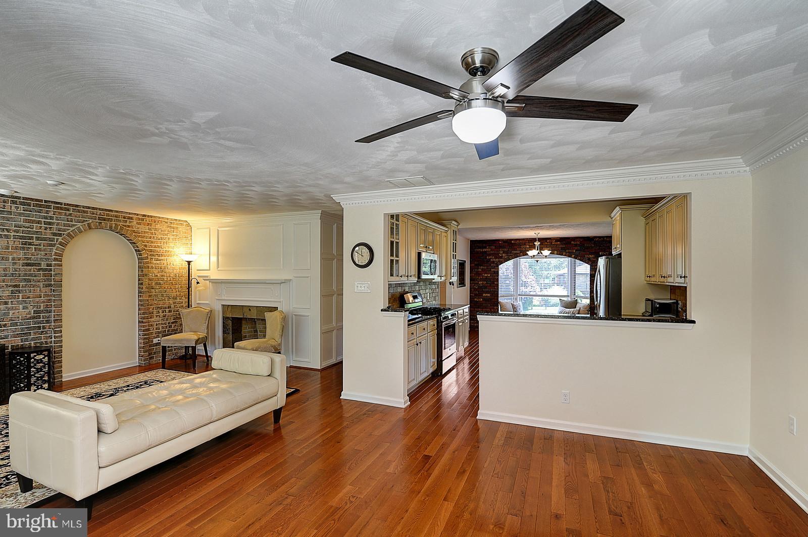 1 Cavalier Drive Hamilton, NJ 08619 - Photo 13 of 44 a living room with furniture and a fireplace