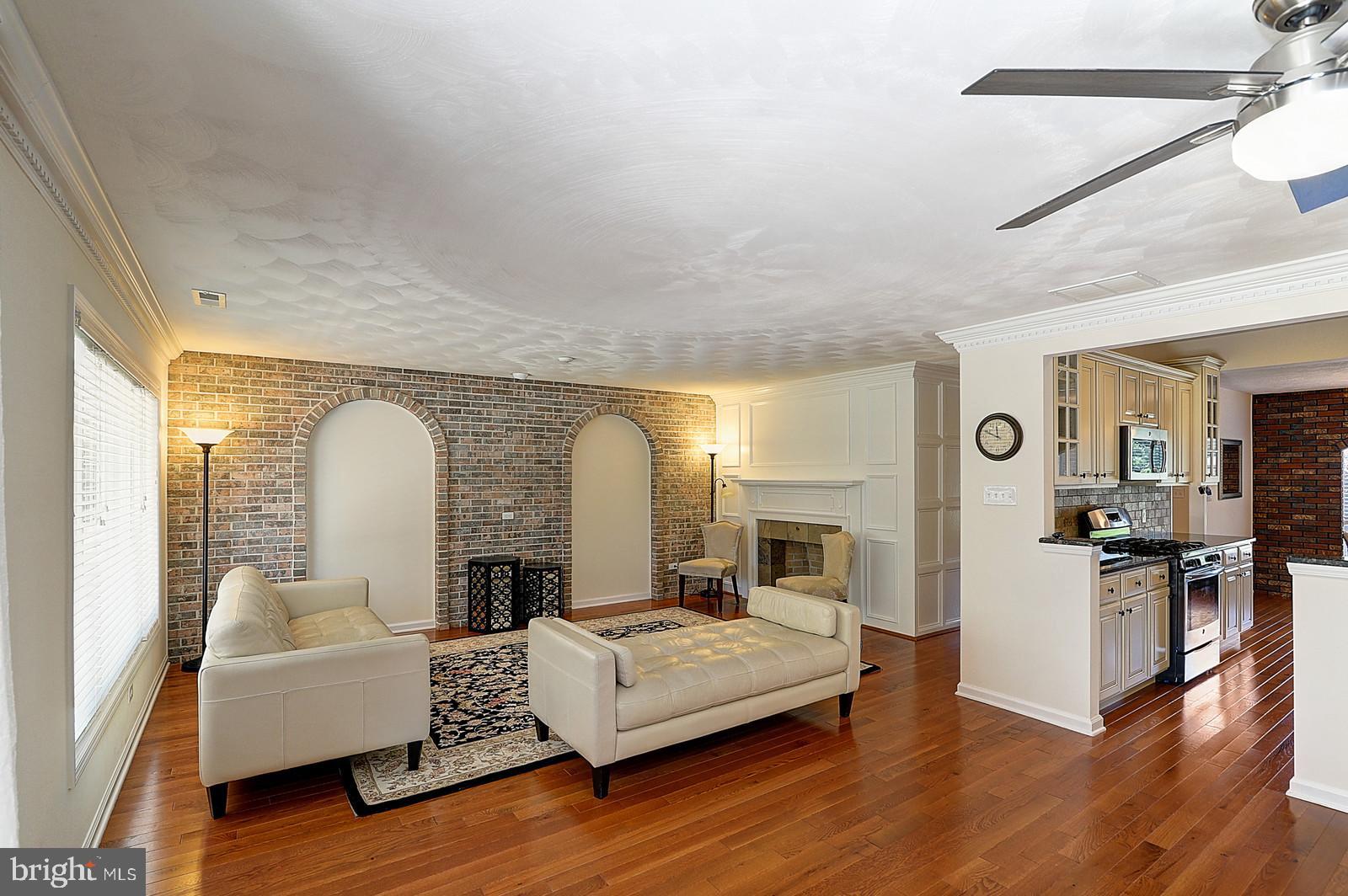 1 Cavalier Drive Hamilton, NJ 08619 - Photo 14 of 44 a living room with furniture and a fireplace