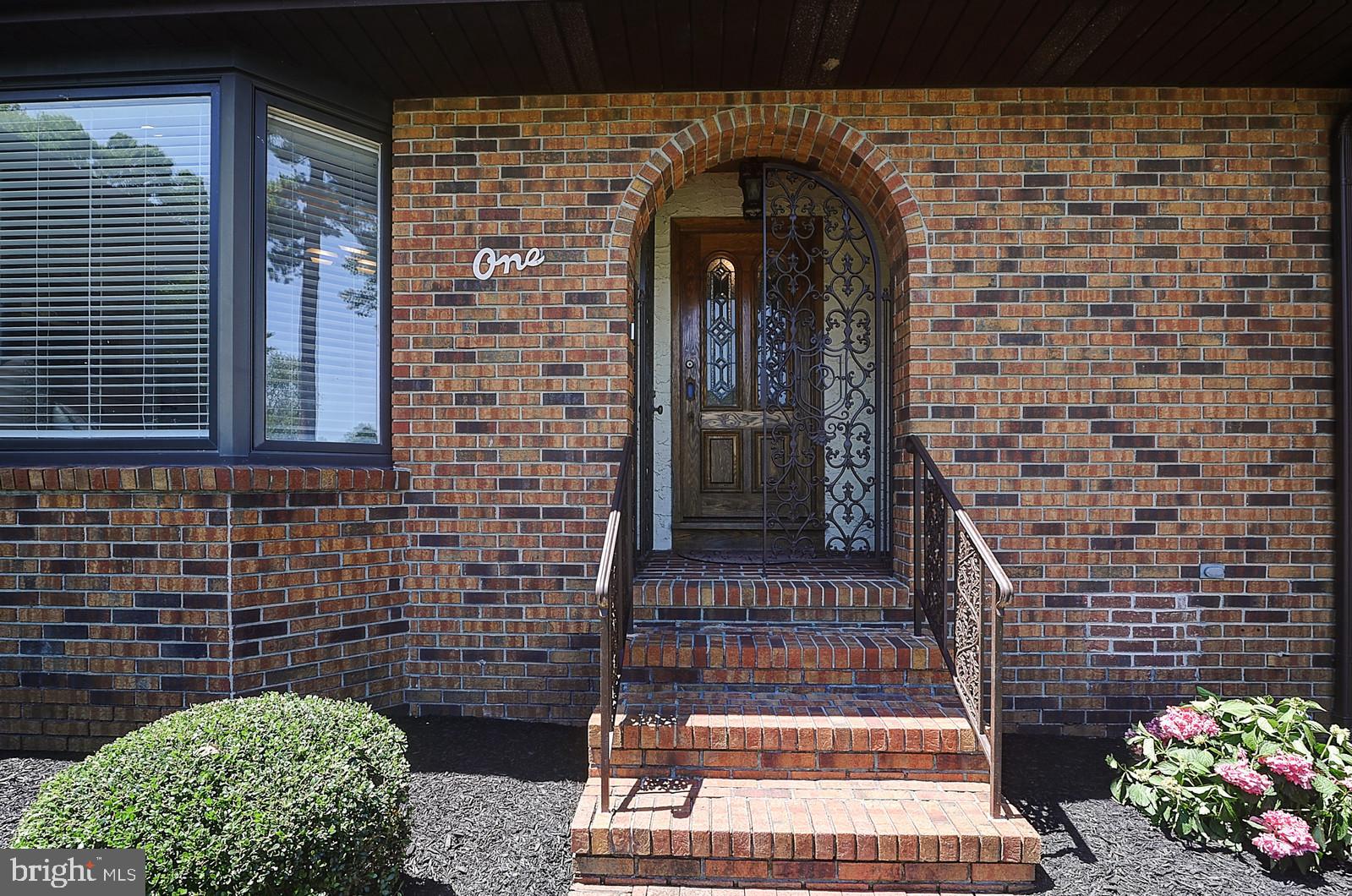 1 Cavalier Drive Hamilton, NJ 08619 - Photo 3 of 44 a front view of a house with a garden
