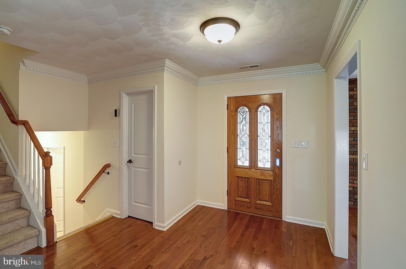 1 Cavalier Drive Hamilton, NJ 08619 - Photo 26 of 44 an empty room with wooden floor and entryway