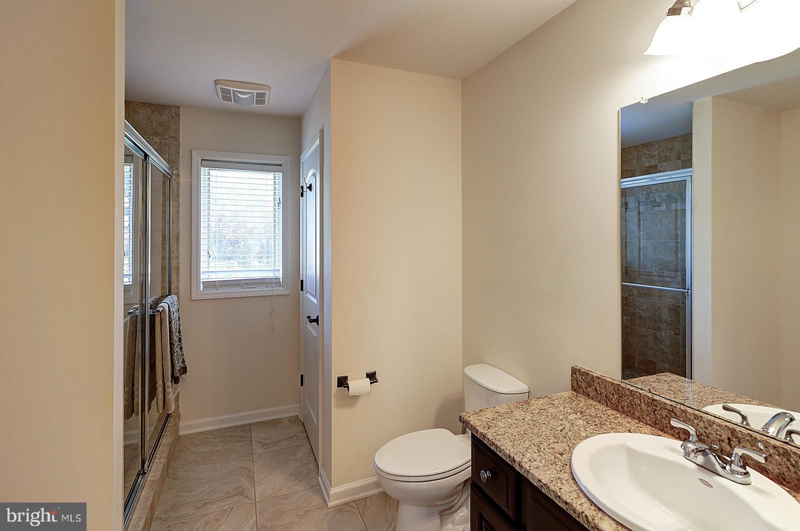 1 Cavalier Drive Hamilton, NJ 08619 - Photo 32 of 44 a bathroom with a granite countertop sink toilet and shower