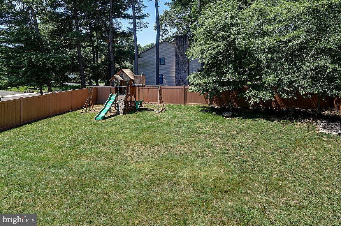 1 Cavalier Drive Hamilton, NJ 08619 - Photo 39 of 44 a view of a garden with a slide