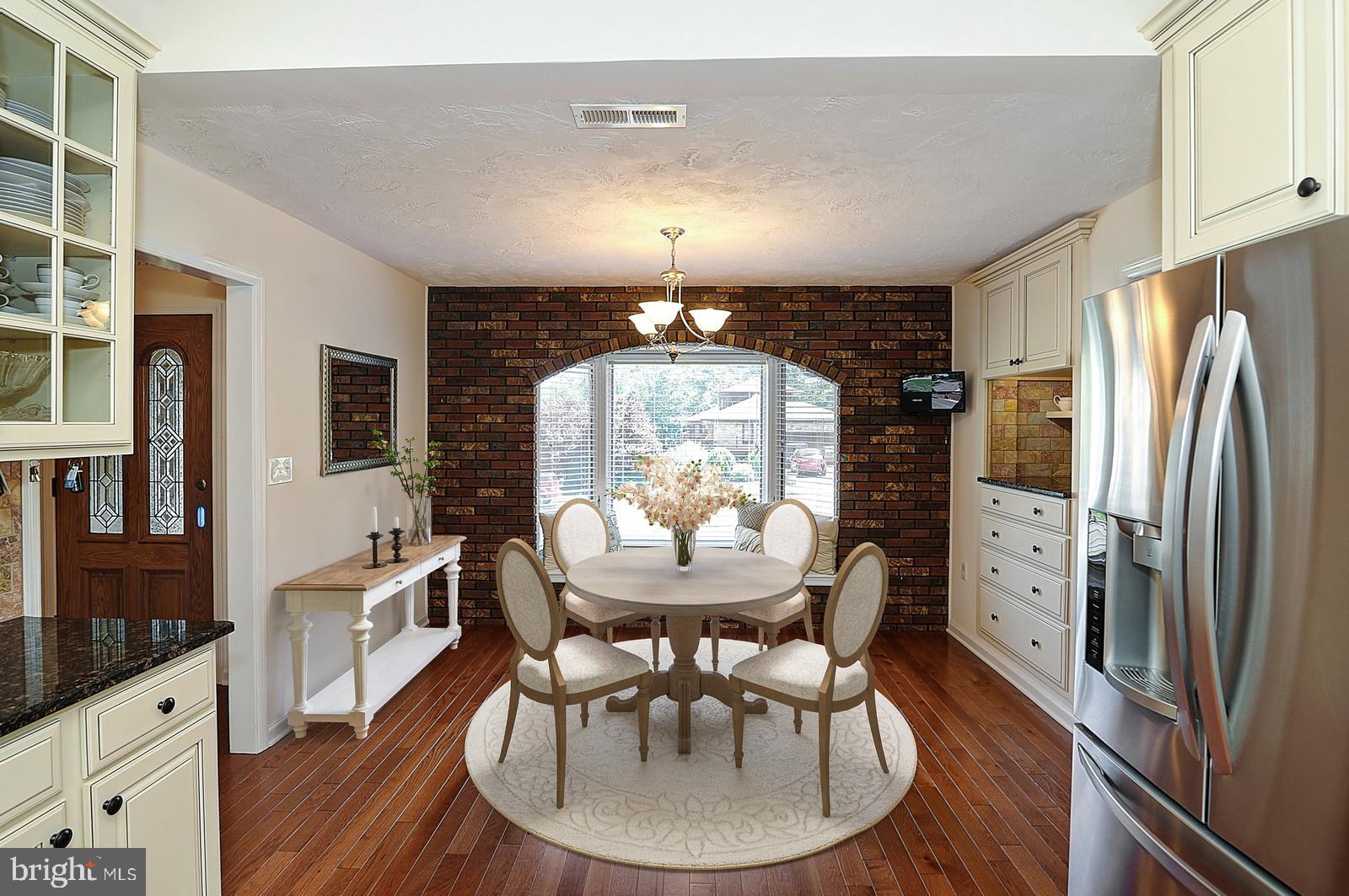 1 Cavalier Drive Hamilton, NJ 08619 - Photo 7 of 44 a view of a dining room with furniture window and wooden floor