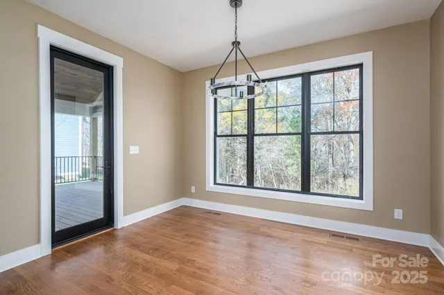 a bathroom with a granite countertop shower a mirror and a sink