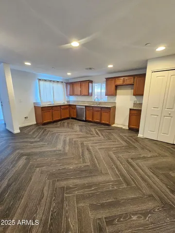 a view of a livingroom with furniture and staircase