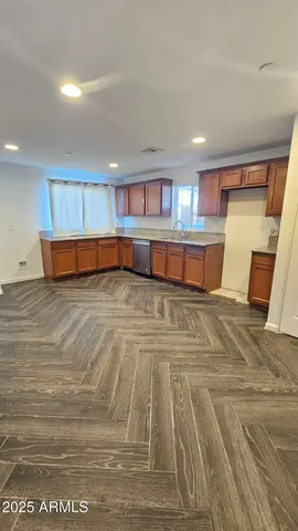 a view of an empty room with windows