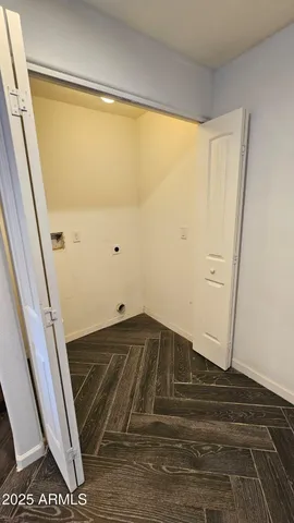 a view of a room with stairs and a window