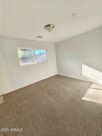 view of an empty room and window