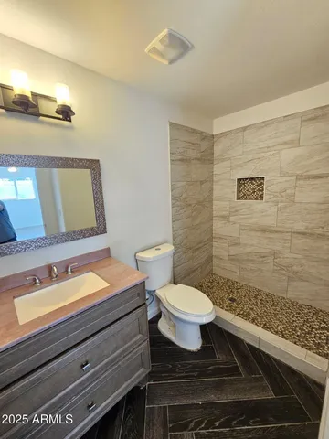 a bathroom with a sink a toilet and bathtub