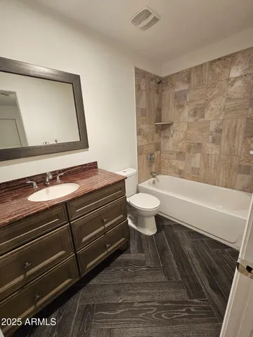 a view of fireplace and wooden floor