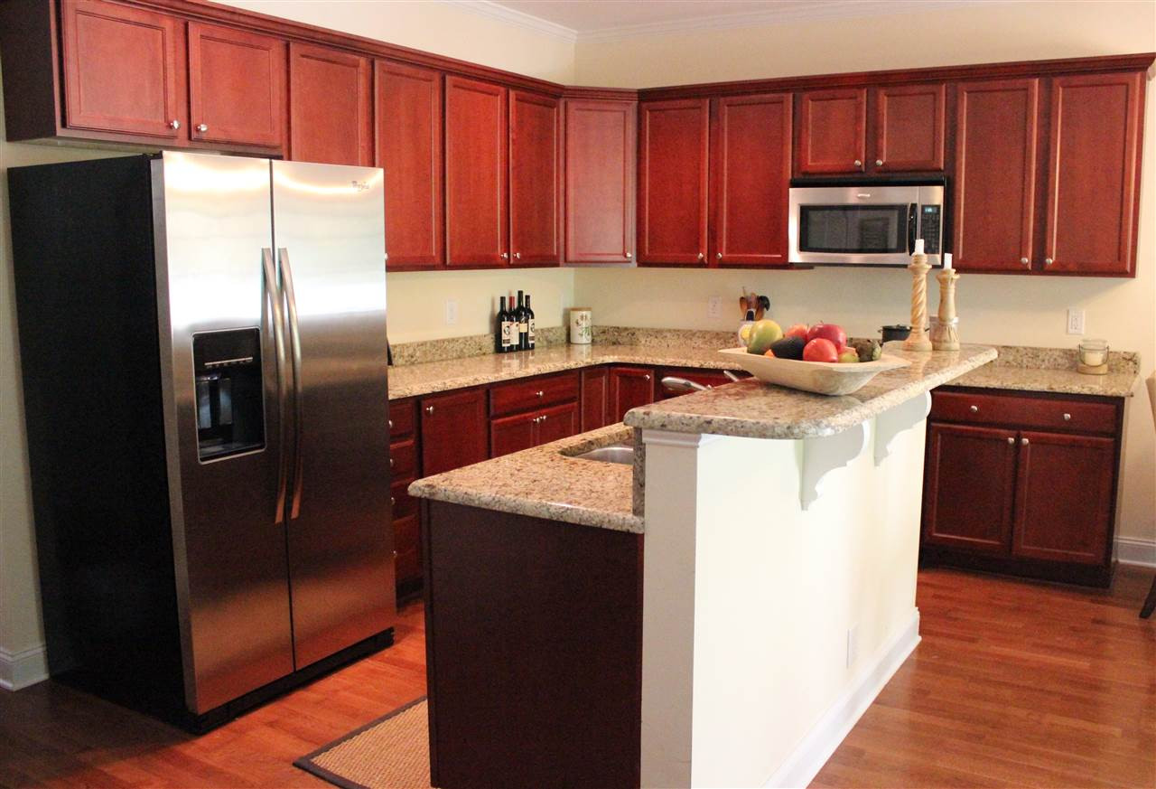2822 Pickett Road, Unit 169 Durham, NC 27705 - Photo 2 of 17 Cook away in this warm, open kitchen recently upgraded with new granite countertops. Brand new hardwood laminate floors installed on main level 7/8/15 Kitchen