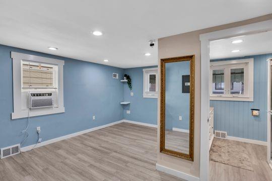 1850 Middle Street Pittsburgh, PA 15215 - Photo 13 of 27 a view of an empty room with wooden floor and a window