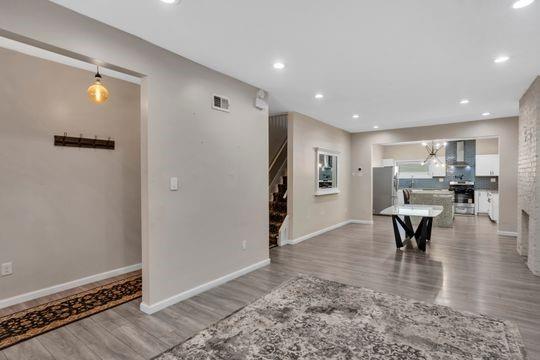 1850 Middle Street Pittsburgh, PA 15215 - Photo 3 of 27 a view of an empty room with kitchen and a window
