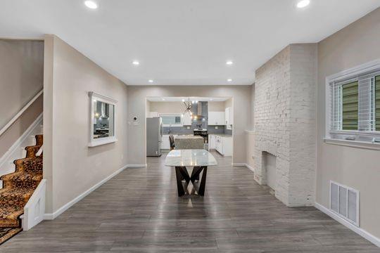 1850 Middle Street Pittsburgh, PA 15215 - Photo 7 of 27 a living room with furniture and a wooden floor