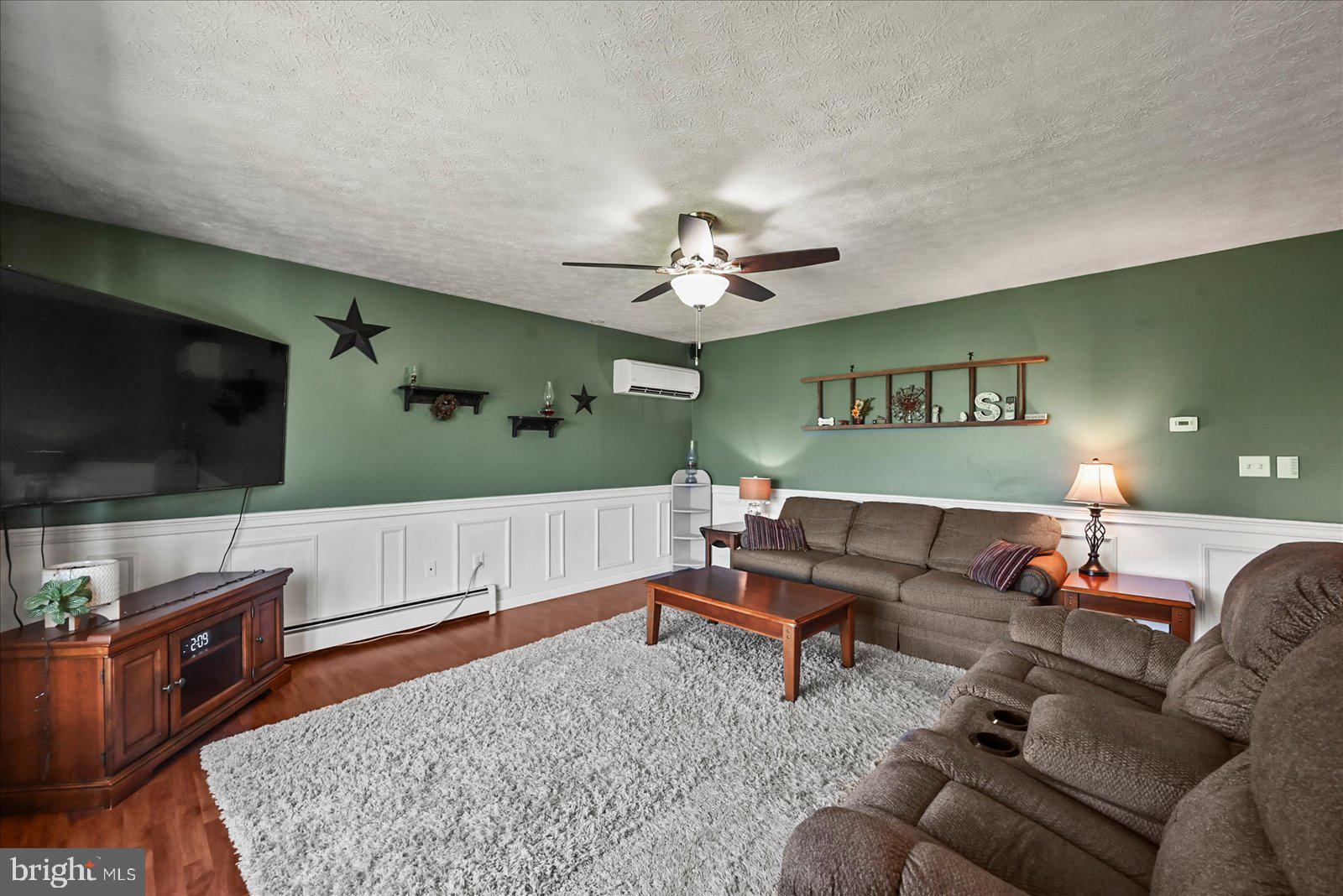 253 Kindig Road Littlestown, PA 17340 - Photo 7 of 41 Cozy living space with green accents.