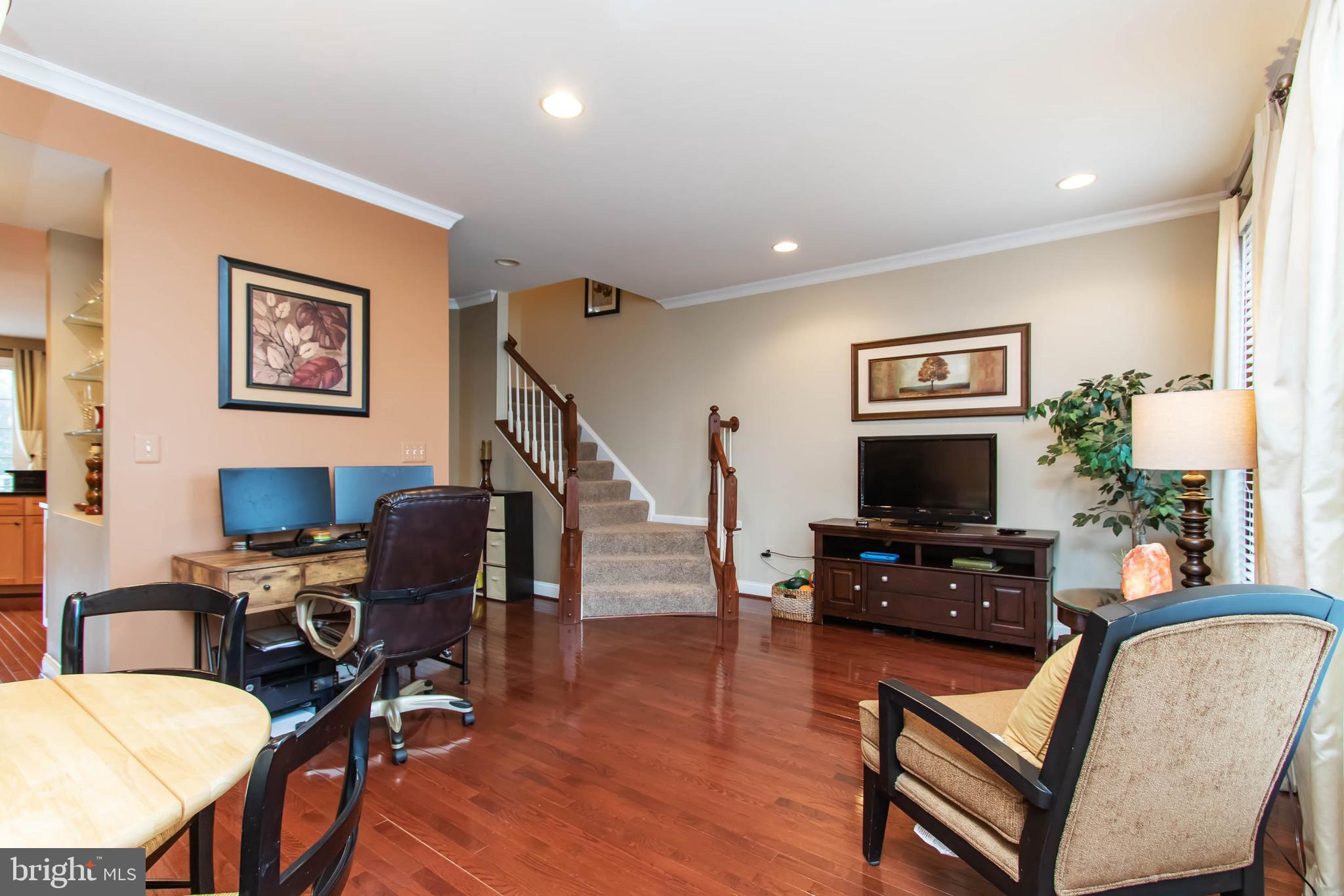 9185 Ribbon Falls Loop Bristow, VA 20136 - Photo 12 of 34 Living Room Opens to Stairs to Upper Level