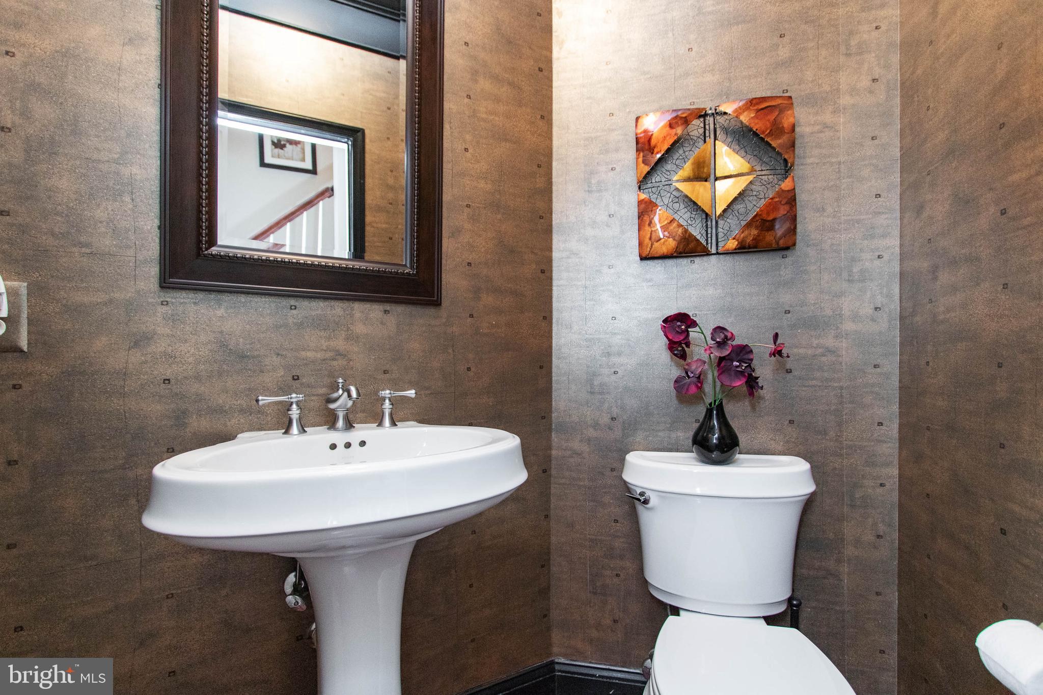 9185 Ribbon Falls Loop Bristow, VA 20136 - Photo 14 of 34 Powder Room with Elegant Crown Moulding