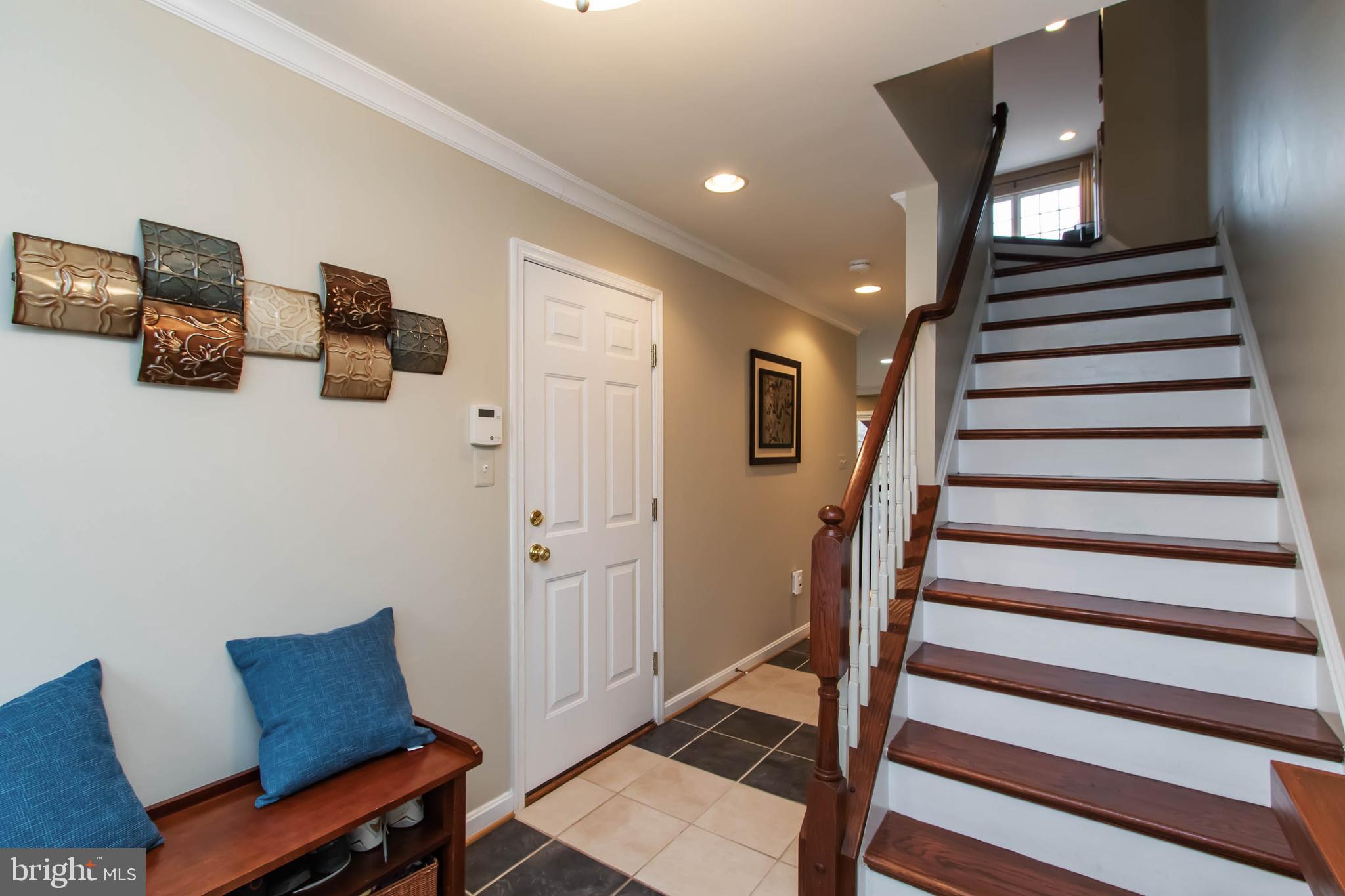 9185 Ribbon Falls Loop Bristow, VA 20136 - Photo 3 of 34 Inviting Foyer with Designer Tile & HDWD Stairs