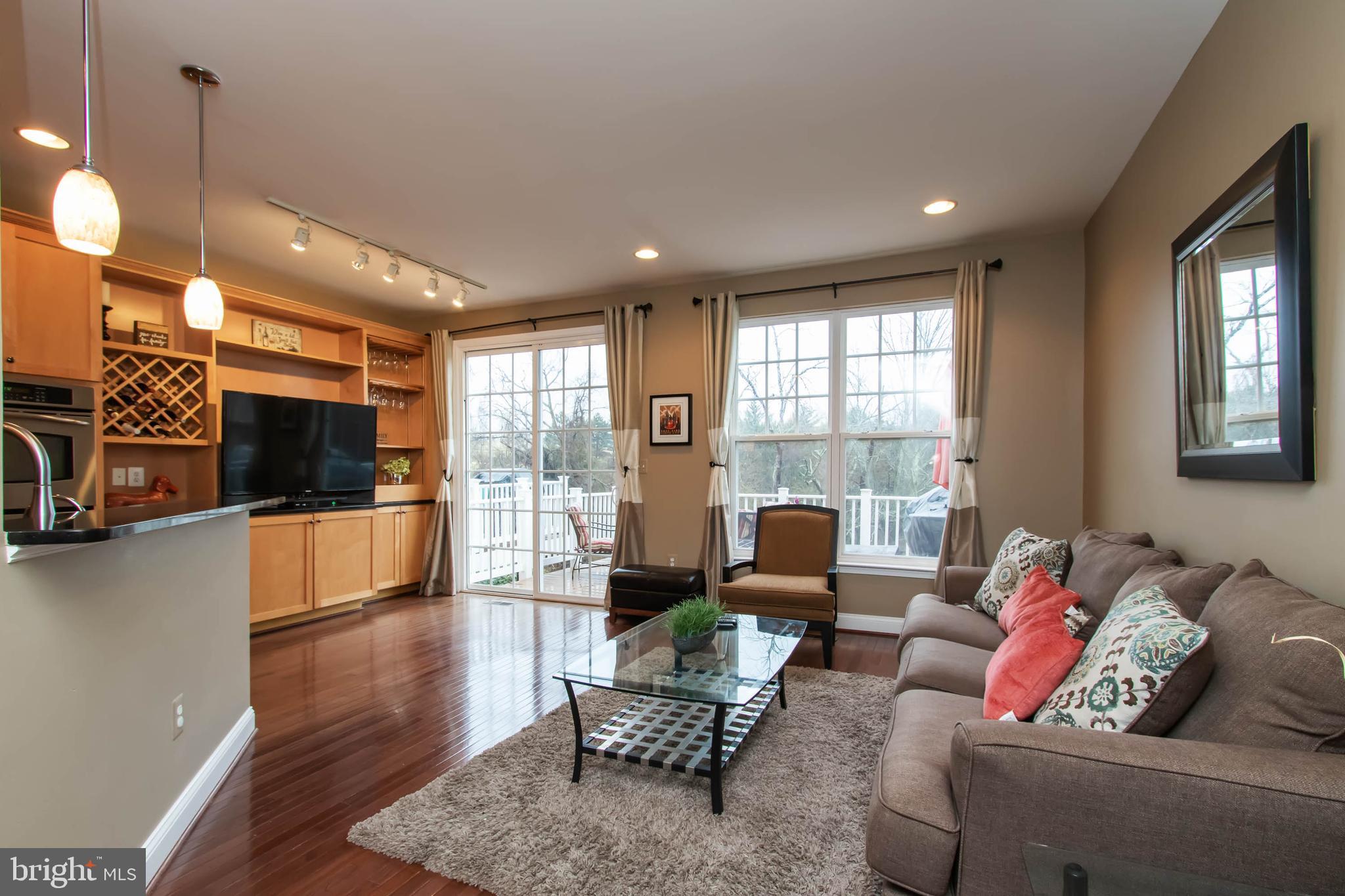 9185 Ribbon Falls Loop Bristow, VA 20136 - Photo 4 of 34 Family Rm Opens to Breakfast Area w/Built-Ins