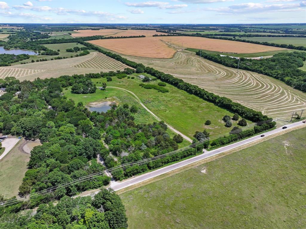 747 Vineyard Road Gunter, TX 75058 - Photo 8 of 32 a view of a field with an ocean view