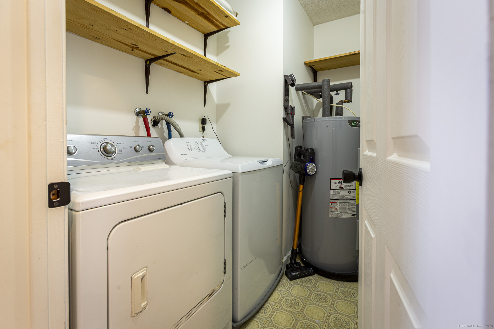 187 Lovers Lane, Unit 61 Torrington, CT 06790 - Photo 19 of 29 a utility room with dryer and washer