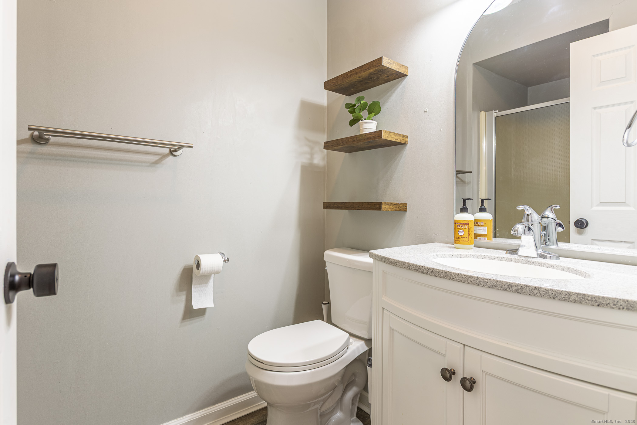 187 Lovers Lane, Unit 61 Torrington, CT 06790 - Photo 21 of 29 a bathroom with a sink toilet and vanity