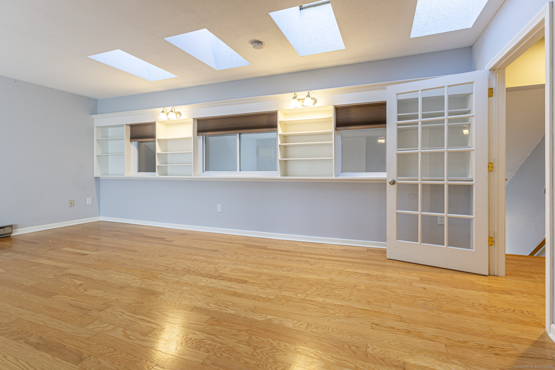 187 Lovers Lane, Unit 61 Torrington, CT 06790 - Photo 23 of 29 a view of an empty room with a window