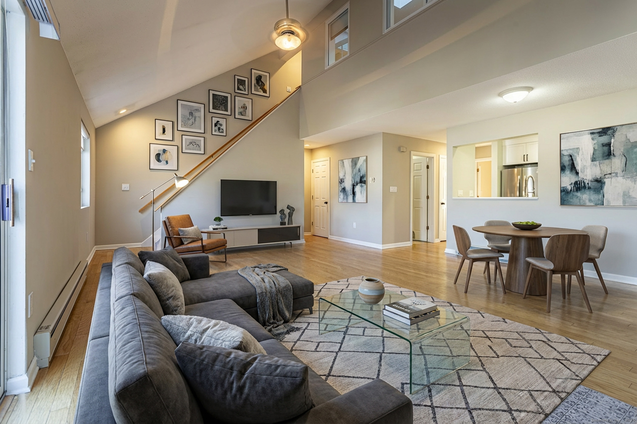 187 Lovers Lane, Unit 61 Torrington, CT 06790 - Photo 4 of 29 a living room with furniture and a flat screen tv