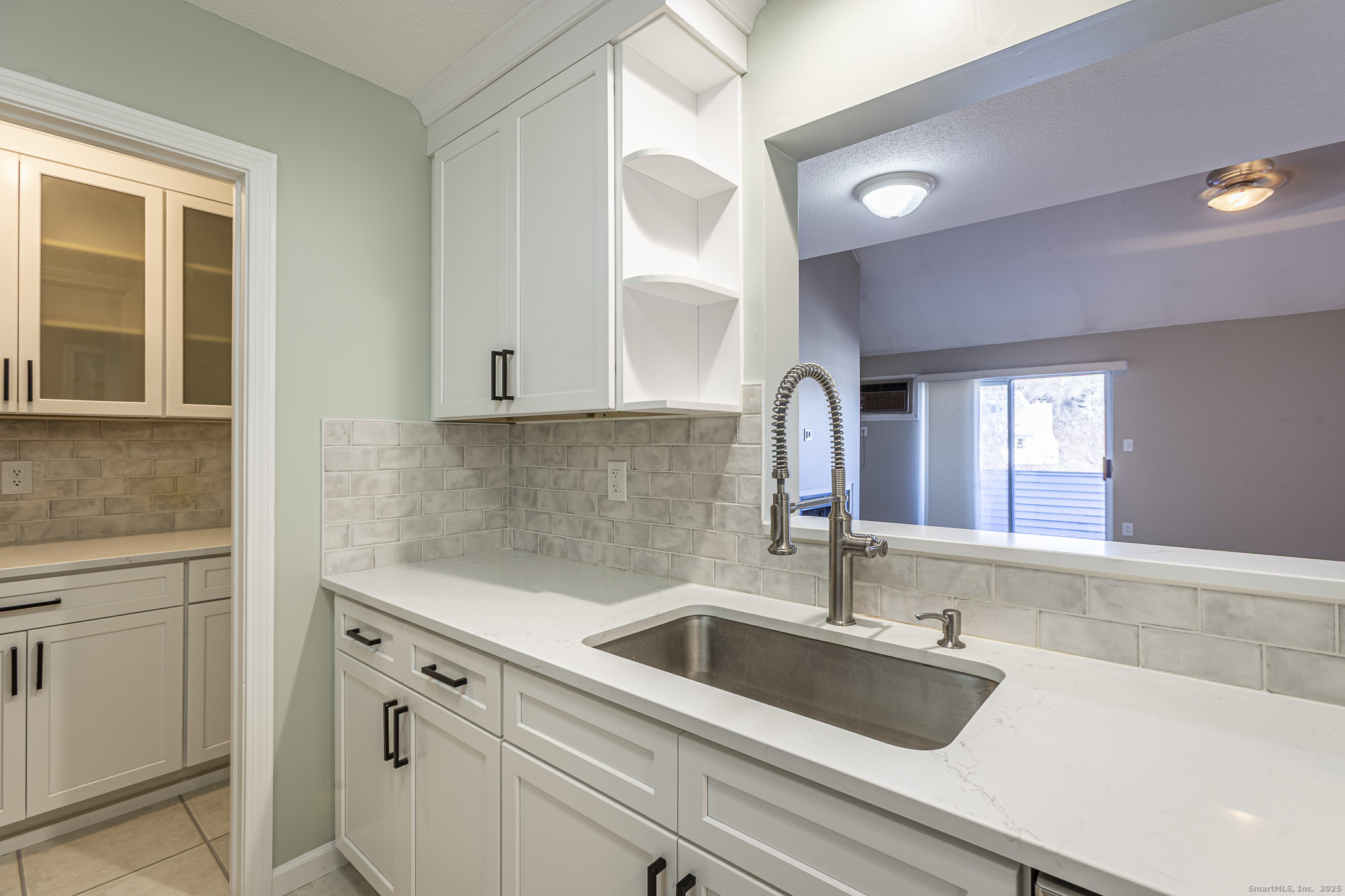 187 Lovers Lane, Unit 61 Torrington, CT 06790 - Photo 8 of 29 a kitchen with a sink and cabinets
