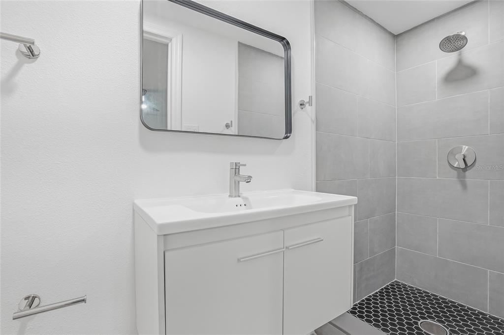 7840 Gulf Way Hudson, FL 34667 - Photo 21 of 37 a bathroom with a sink and a mirror